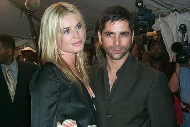 Rebecca Romijn and John Stamos | Femme Fatale premiere | 27th Toronto International Film Festival